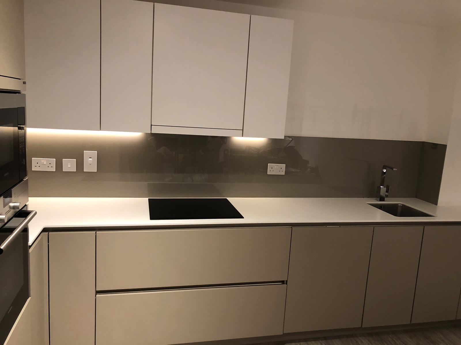 Spotless modern grey kitchen after cleaning